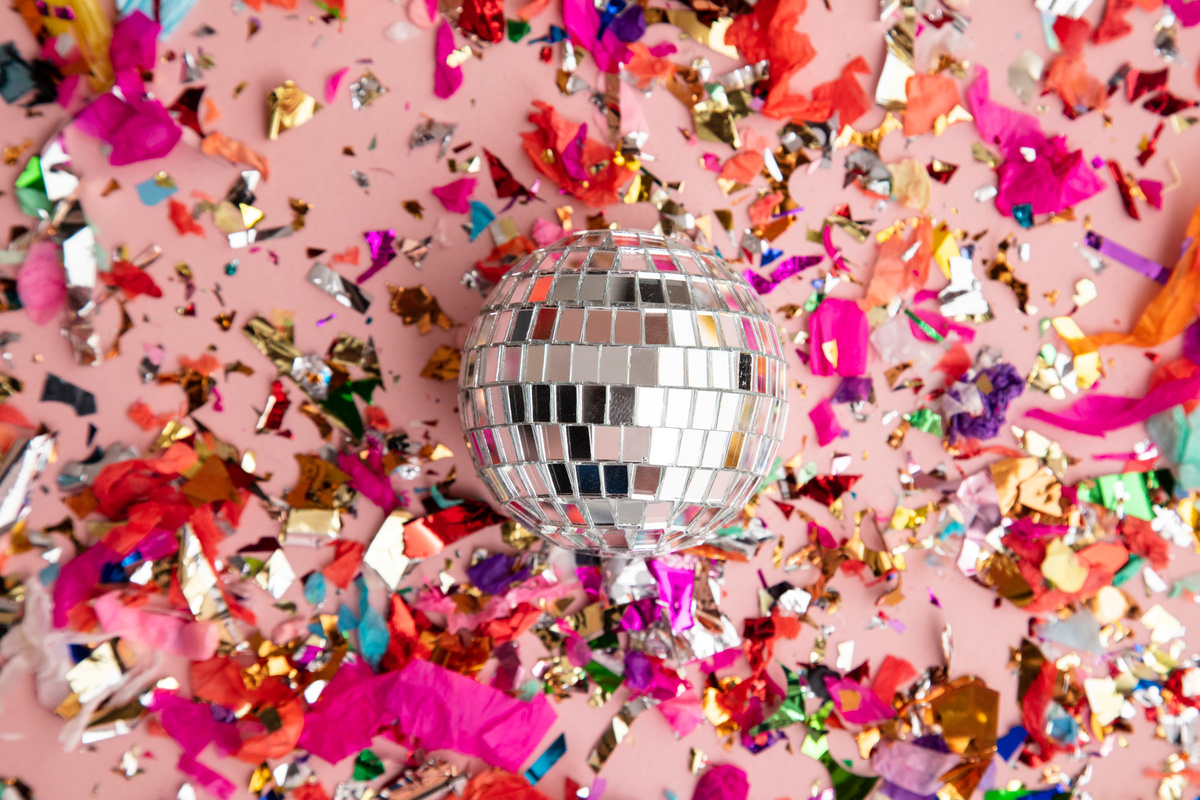 Disco Mirror Ball on Bright Party Confetti Background